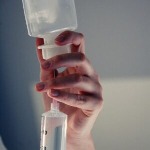 a person holding a syringe