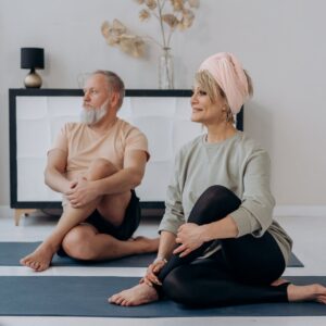 an elderly couple exercising together