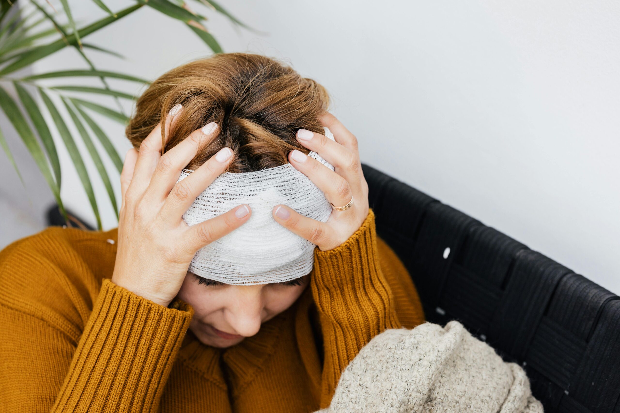 Article about Natural Migraine Relief with the featured image showing a lady suffering from a migraine.